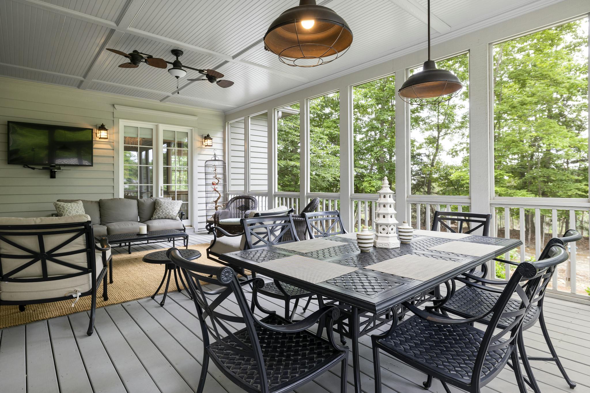 Spacious outdoor patio featuring elegant furniture with a scenic view, perfect for relaxing.